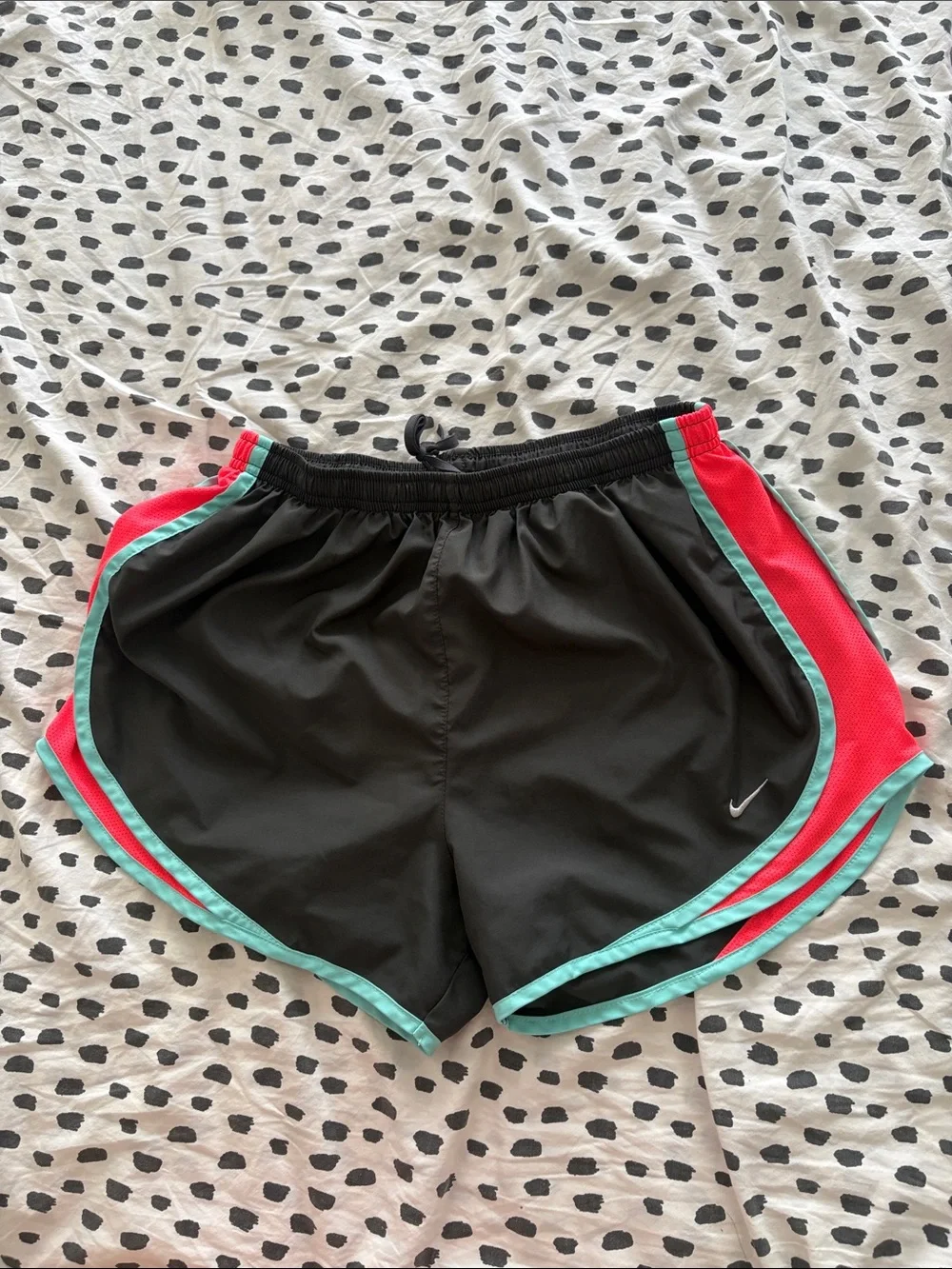 Nike Black Athletic Shorts with Teal Trim and Coral Side Panels
